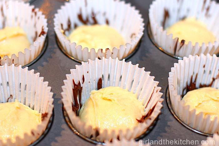 These Nutella Cheesecake muffins are your dessert for breakfast!  Tender, moist muffing filled with gooey Nutella and creamy a cheesecake filling.