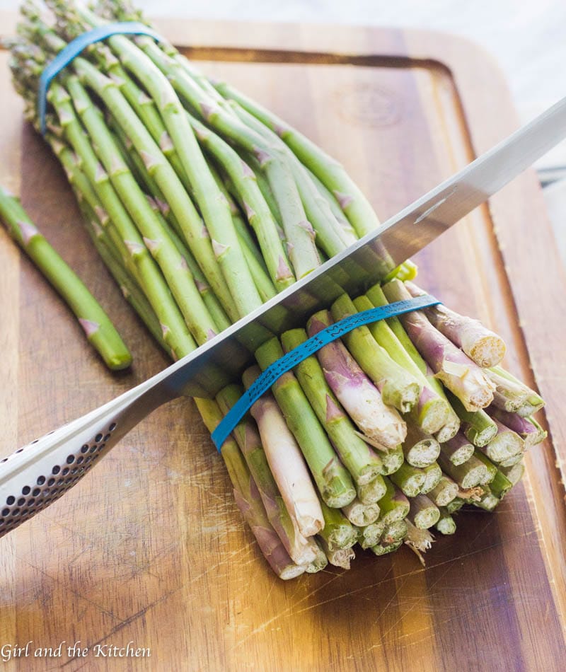 This Lemon Parmesan Asparagus is the perfect side dish for any entree! It is crispy, savory and delicious, best of all it is ideal for a quick and easy weeknight veggie as it comes together in two minutes and and roasts up in only seven minutes!