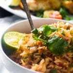 Learn how to make quick and easy Restaurant Style Mexican Rice the healthy way! It tastes just like the restaurant but is made in half the time and with half the fat!
