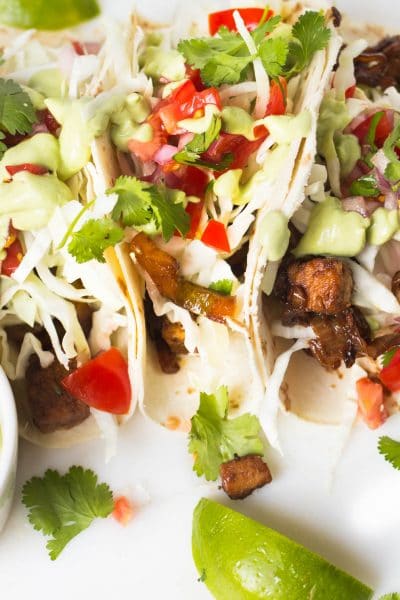 These extremely flavorful and tender tacos made with Quorn Chikn Tenders are perfect for a meatless meal! Loaded with savory and spicy veggies, crispy cabbage and an avocado and cilantro cream this will make any week night seem like a night out in a Mexican taco stand...minus the grease!