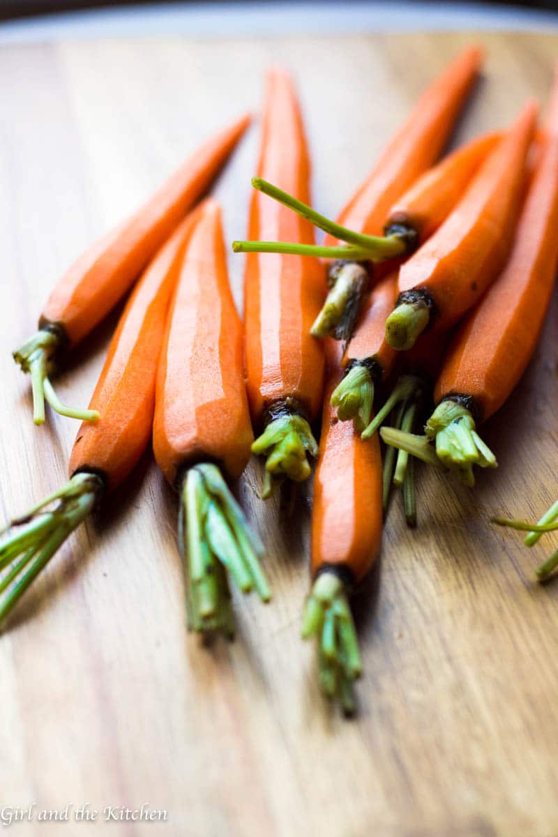 These roasted carrots are glazed with a nutty brown butter that is loaded with garlic and red pepper flakes. This easy side dish ends the age old problem of boring vegetables.
