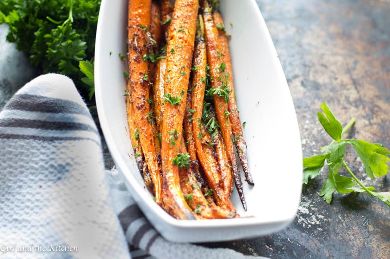 These roasted carrots are glazed with a nutty brown butter that is loaded with garlic and red pepper flakes. This easy side dish ends the age old problem of boring vegetables.