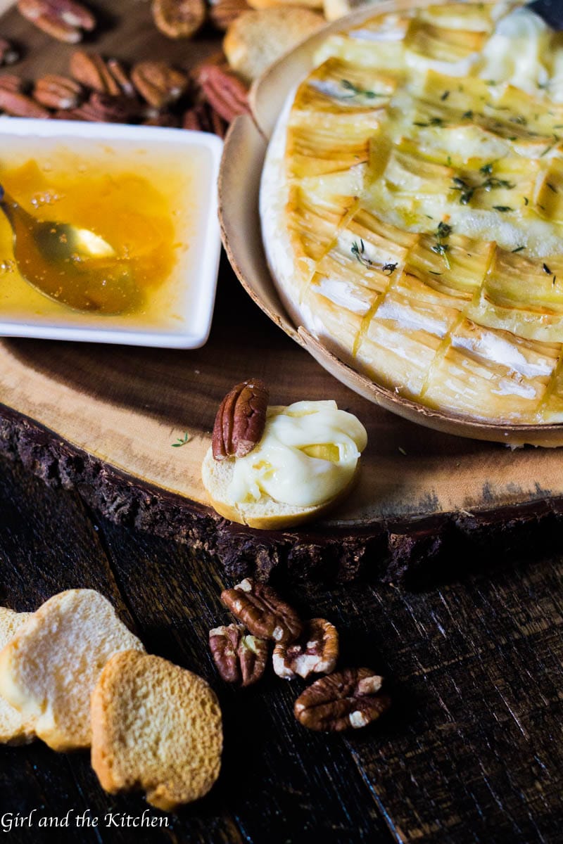 This gooey garlic baked brie has only 4 ingredients and takes 15 minutes to prepare! It comes out of the oven gooey and cheesy and loaded with rich garlic and herb flavors! This is the ultimate holiday appetizer for any party!