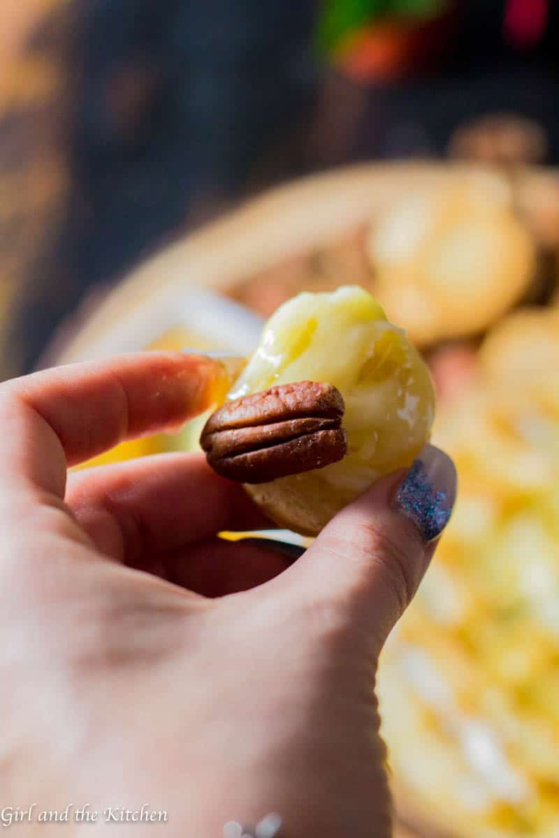 This gooey garlic baked brie has only 4 ingredients and takes 15 minutes to prepare! It comes out of the oven gooey and cheesy and loaded with rich garlic and herb flavors! This is the ultimate holiday appetizer for any party!