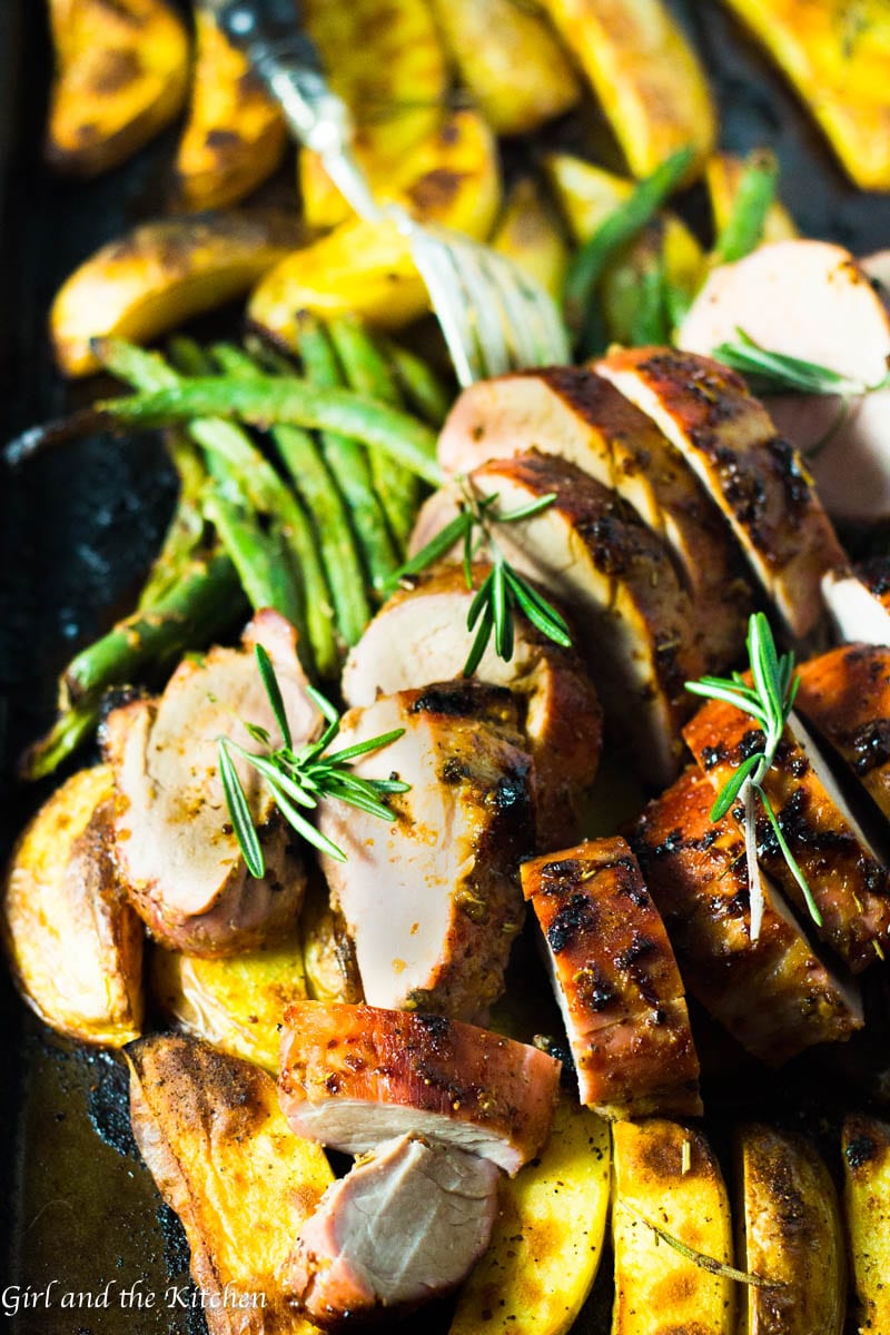 This incredibly flavorful Roasted Pork Tenderloin is absurdly simple to make and filled with mustardy and garlicky flavors! The best part is all the glorious juices from the pork act as a sauce for the veggies creating one uber flavorful one pan meal! This is one holiday meal that most certainly will impress everyone and tire no one! Plus learn the ultimate trick to getting a gorgeously browned tenderloin in only 30 minutes!