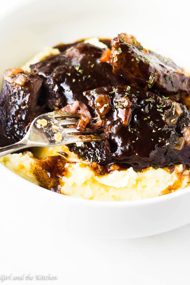 Instant pot short ribs glazed on top of mashed potatoes