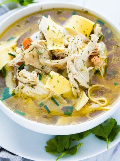 Learn how to make instant pot chicken soup with this delicious guide!  The recipe is absurdly simple yet  filled with loads of hearty flavor all with the added bonus of a one pit meal!