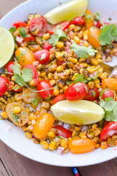 corn and tomatoes and lime in a bowl - Girl and the Kitchen