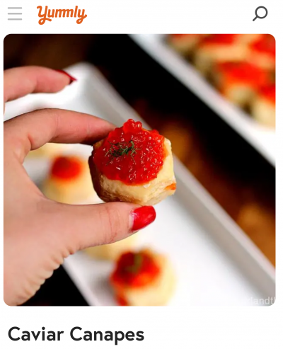 yummly recipe with image of a woman's hand holding a cavier canapes